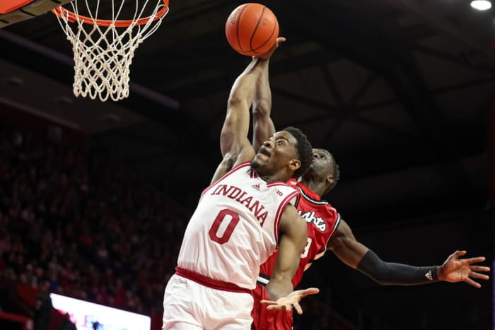 Indiana Hoosiers guard Xavier Johnson (0) drives to the basket as Rutgers Scarlet Knights forward Mawot Mag (3) defends during the first half at Jersey Mike's Arena.